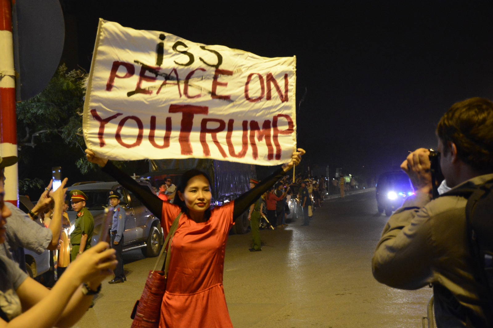 Mai Khoi and Trump banner