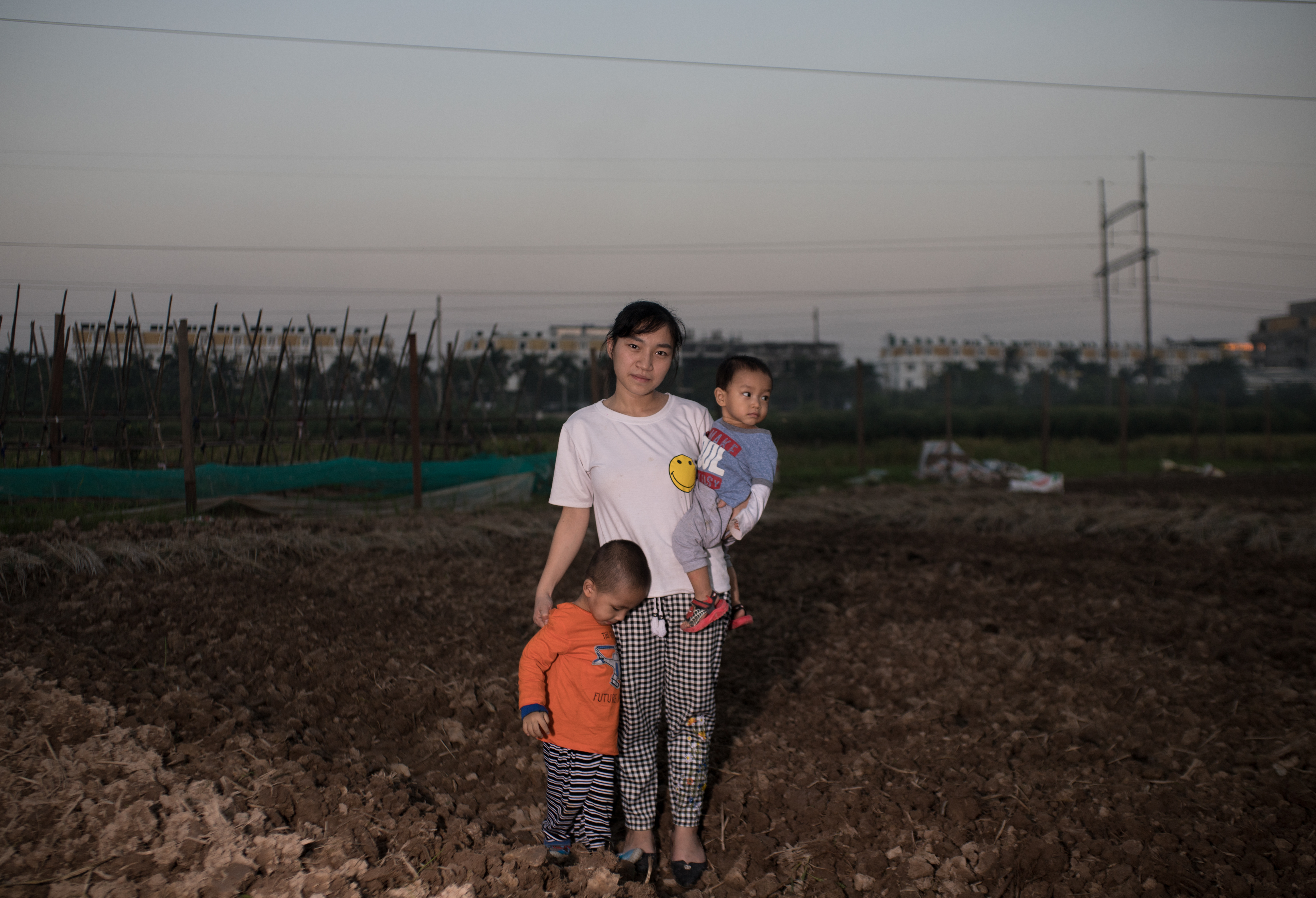 Thu Do, Wife of Land Rights Activist Trinh Ba Phuong, and children